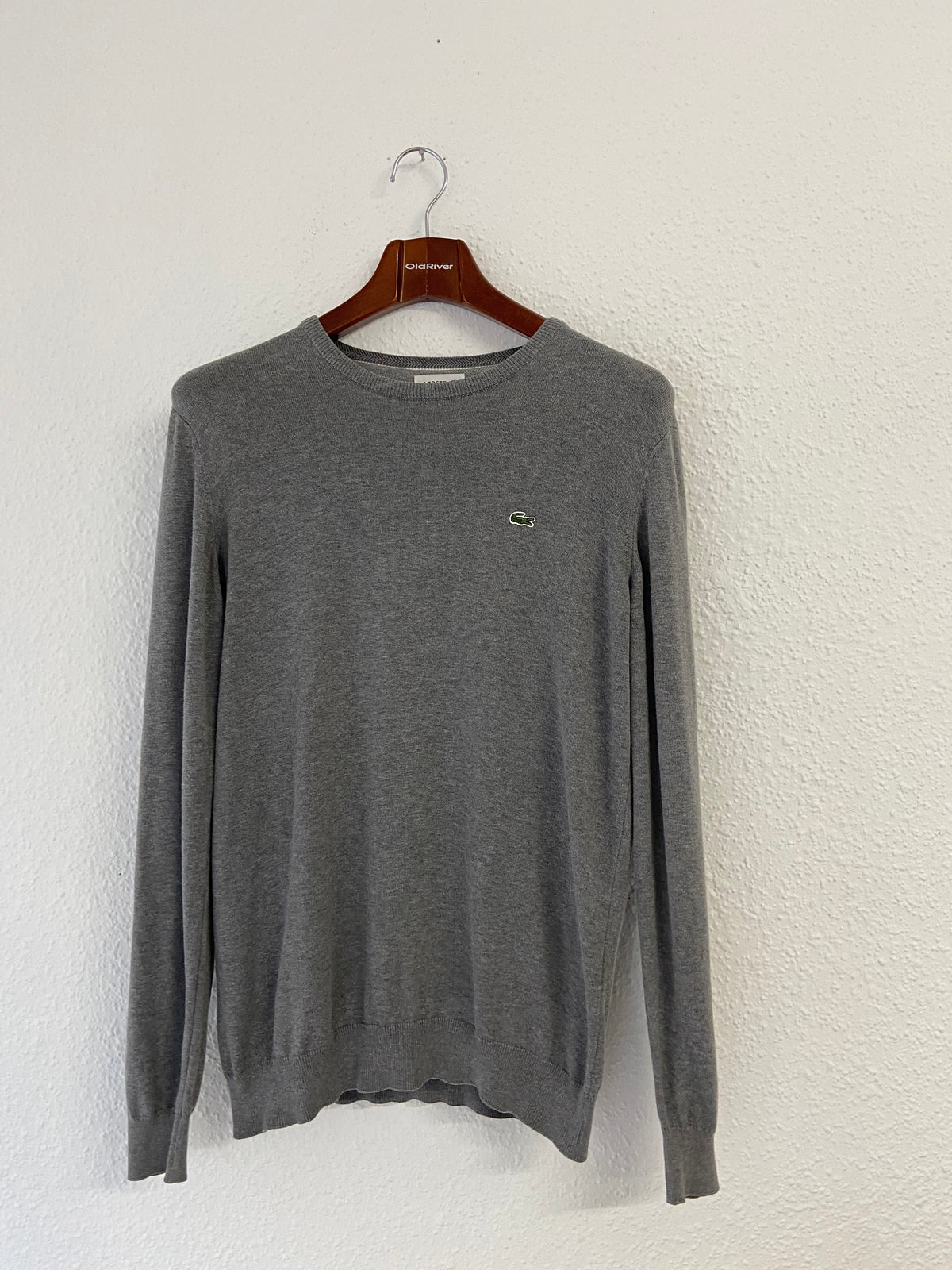 Pull gris Lacoste taille L col rond